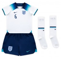 Camiseta Inglaterra Harry Maguire #6 Primera Equipación Replica Mundial 2022 para niños mangas cortas (+ Pantalones cortos)